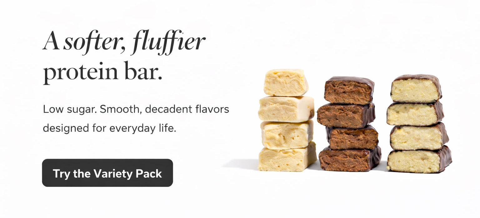 Stacks of protein bars with text describing the product on a white background